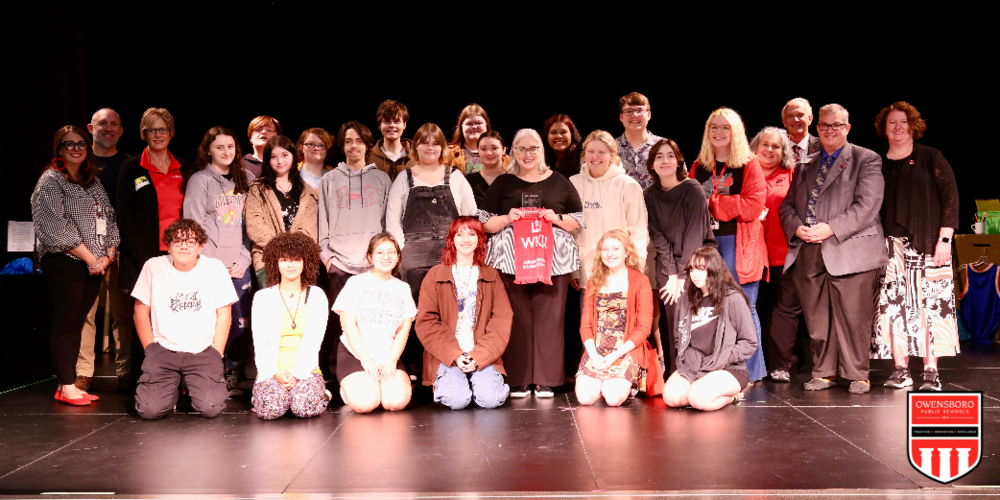 Greer with Students on Stage